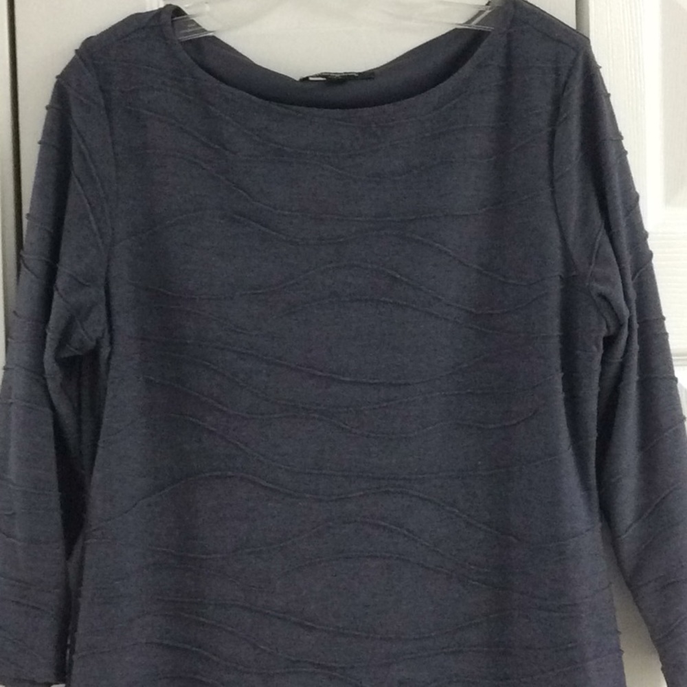 Slate blue knit dress with scrolling raised trim.